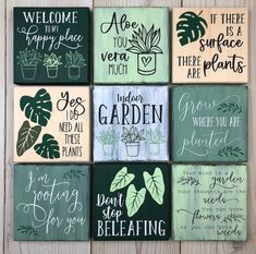 wooden signs with plants and sayings on them