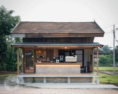 a small house with an outdoor kitchen on the porch