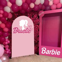 a barbie themed party with balloons and decorations