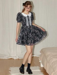 This product offers a charming doll collar floral petite dress that exudes a vintage-inspired aesthetic. With puff sleeves and a flared skirt, this dress captures a youthful and whimsical spirit. It's a delightful choice for those who appreciate the nostalgic charm in their wardrobe. - Features a doll collar with delicate lace trimming, enhancing the vintage look- The gathered waist and flared skirt create a flattering silhouette, suitable for various body types- Puff sleeves add a playful Feminine Vintage Dress With Doll Collar For Spring, Doll Collar Dress, Inspired Aesthetic, Doll Collar, Petite Dress, Vintage Doll, Flared Skirt, Petite Dresses, Flare Skirt