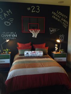 a basketball themed bedroom with chalk writing on the wall