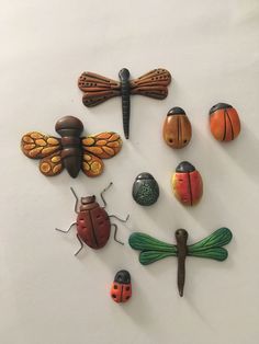 a group of different types of bugs on a white surface