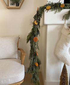 a christmas garland with oranges hanging from it