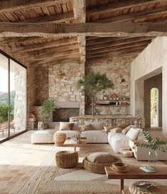 a living room filled with furniture and stone walls