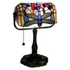 a table lamp with a dragonfly design on it