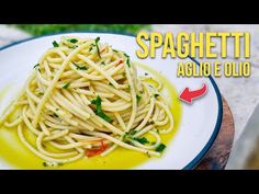 spaghetti on a white plate with yellow sauce