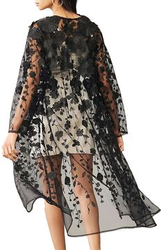 Floral appliqués sweeten the look of a duster crafted from airy mesh for lightweight layering. Long sleeves 100% polyester Hand wash, line dry Imported Model stats: 5'10" height, 32" bust, 25" waist, 36" hip. Black Party Cover-up For Spring, Sheer Black Cover-up For Spring, Black Sheer Cover-up For Spring, Black Sheer Long Sleeve Outerwear, Black Cover-up For Spring Party, Spring Black Long Sleeve Cover-up, Spring Sheer Party Outerwear, Spring Party Sheer Outerwear, Spring Party Outerwear With Sheer Sleeves