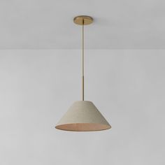 a light fixture hanging from the ceiling in a room with white walls and flooring