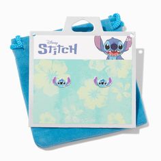 the stitch earrings are on display in front of a package