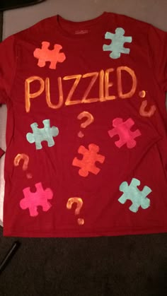 a t - shirt with the word puzzle written on it