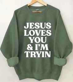 Jesus loves you and I m trying Sweater,faith based sweatshirt,Jesus sweater,christian sweatshirt,Jesus loves you sweater,Christian Apparel Welcome to Bee Design Gifts If you are looking for soft, comfy, first-rate sweatshirts, you're in the right place! I love what I do and strive to make your shopping experience just right for you. If you have any questions, concerns or comments about my products, feel free to send a message anytime. ⭐ 50% cotton, 50% polyester ⭐ Pre-shrunk ⭐Classic fit ⭐ 1x1 athletic rib knit collar with spandex ⭐ Air-jet spun yarn with a soft feel and reduced pilling ⭐Double-needle stitched collar, shoulders, armholes, cuffs, and hem HOW TO PLACE ORDER 1. Check photos for size chart, model comparison and color options 2. Select size and color from the drop down options Jesus Sweater, Jesus Sweatshirts, Christian Sweatshirt, Christian Apparel, Bee Design, Jesus Loves You, Faith Based, Christian Shirts