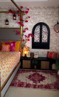 a bed room with a neatly made bed next to a window and a rug on the floor