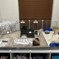 a cage filled with lots of different types of animal items in it's display area