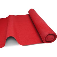 a roll of red felt sitting on top of a white surface