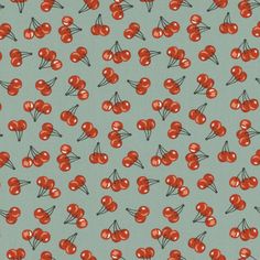 a blue background with small red cherries on the top and bottom of each cherry