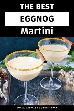 two glasses filled with eggnog martini on top of a tray