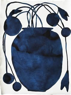 a blue vase filled with berries on top of a white tablecloth covered in black ink