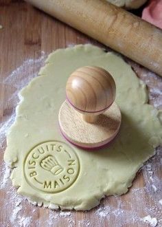 a wooden stamper sitting on top of a dough