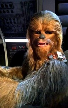 chew - oo is sitting in the cockpit of a star wars vehicle