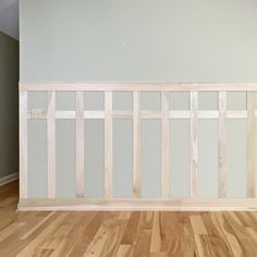 an empty room with hard wood flooring and white paint on the walls in it