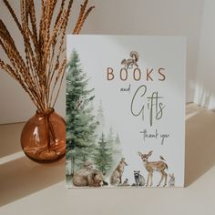 there is a card that says books and gifts with animals in the woods behind it