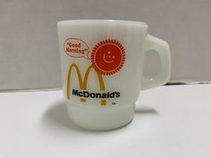 a mcdonald's coffee cup with a smiley face on it