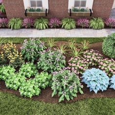 a garden with various plants and flowers in front of a brick building on the grass