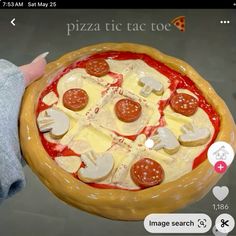 someone is holding up a pizza with different toppings on it's crustes