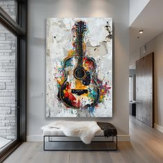 a guitar painting hanging on the wall in a living room