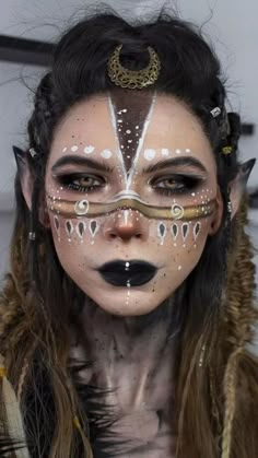 Halloween Makeup 2023: 21 Spooky and Creative Ideas - thepinkgoose.com Druid Markings, Elf Markings, Gold Fairy Makeup, Druid Makeup, Spiritual Makeup, Spiral Makeup, Bio Punk, Witch Dance, Warrior Makeup