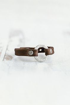 The “I Am” mantra bracelet collection was designed with the intention to empower the strength within us. Handcrafted with the softest lamb leather you’ll find the words “I Am Grateful” softly etched around the brushed silver center ring, a daily reminder to hold space with your gratitude. **Contents** * Lambskin leather, zinc alloy hardware * Button clasp closure * Handmade **Care/Import** * Made in the USA **Dimensions** * Adjustable to fit wrist sizes 6.5”-8” | Giving Bracelets Brushed Silver Hold Space, Mantra Bracelet, Bracelet Collection, I Am Grateful, Daily Reminder, Lambskin Leather, Womens Jewelry Bracelets, Mantra, Zinc Alloy