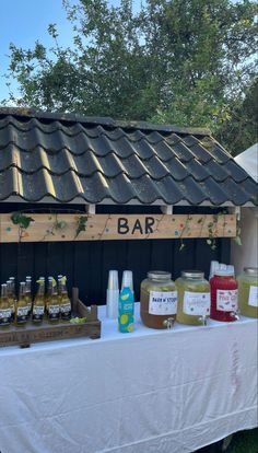 a table topped with lots of bottles of liquid