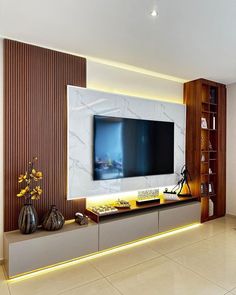 a large flat screen tv mounted to the side of a wall in a living room