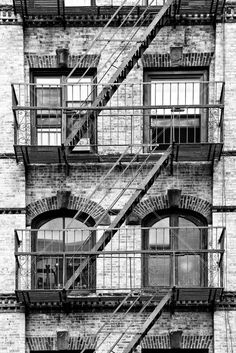 an old brick building with fire escape stairs