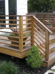 a wooden deck with planters on it