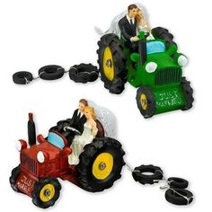 two wedding figurines in the shape of tractors with bride and groom on them