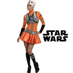 a woman in a star wars costume is posing for the camera with her hands on her hips