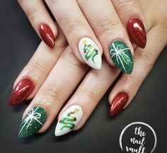 Get ready to sleigh the holiday nail game! 🎄💅 Explore our dazzling collection of 50+ Elegant Christmas Nail designs that are anything but ordinary. From festive patterns to whimsical winter scenes, these nail art ideas will add a burst of creativity to your holiday look. Dive into the festive spirit with a palette of colors, textures, and designs that bring the magic of Christmas to your fingertips. #amazing #christmas #nails #nailart Nail December, Nail Art Vert, Emerald Nails, Green Nail Art, 5 December, Green Nail Designs