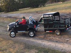 a man driving a truck with a trailer attached to it