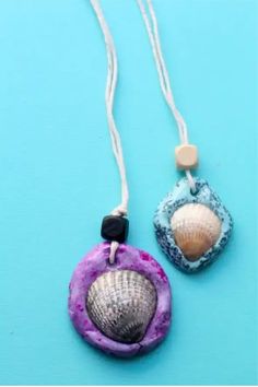 Two handmade shell necklaces with blue and purple clay pendants on a blue background. Summer Crafts For Toddlers, Fun Summer Crafts, Arts And Crafts For Teens, Mermaid Crafts, Summer Camp Crafts, Arts And Crafts House, Arts Ideas, Summer Crafts For Kids, Easy Jewelry