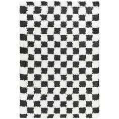 a black and white checkered rug on a white background with an area rug in the middle