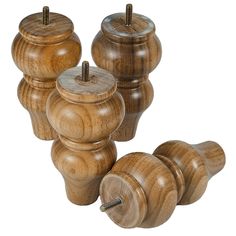 four wooden knobs with screws on them