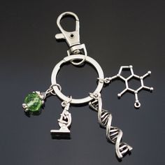 Science Biology DNA Microscope Molecule Genomics Charms Clip On Keychain Scientists Professor Doctor Teacher Student Gift 4 Charm Pendant Cilp On Keychain: Microscope DNA Strand Molecule Green Gem Dna Microscope, Biology Jewelry, Science Pins, Dna Strand, Clip Keychain, Scientist Gifts, Science Jewelry, Green Gem, Science Themes