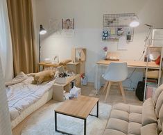 a room with a bed, desk and chair