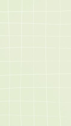 an airplane is flying in the sky over some white squares on a light green background