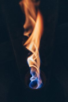 the fire is glowing brightly in the dark