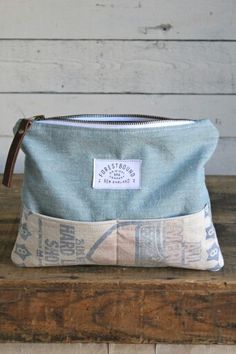 a blue and white bag sitting on top of a wooden table