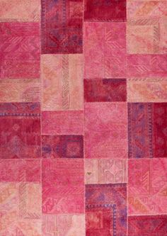 an area rug with many different colors and patterns on the carpet, including pinks