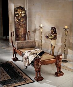 an egyptian themed bedroom with candles and furniture