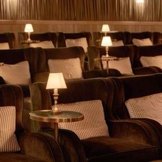 rows of chairs with lamps on them in a room